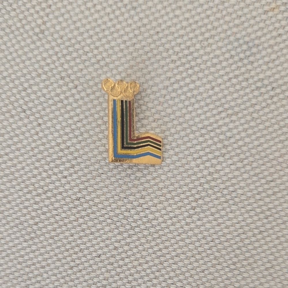 This is a vintage Winter Olympics logo Collector's Pin.